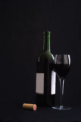 Wine glass with open bottle