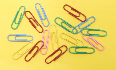 paperclips on yellow