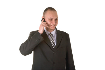 Smiling businessman calling on phone