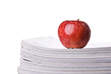 Apple over a stack of books