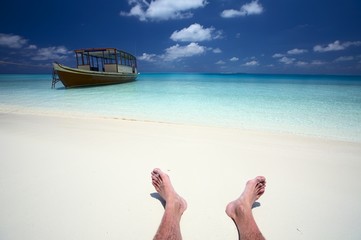 sailor has a rest on a beach