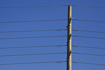 Power lines on blue sky