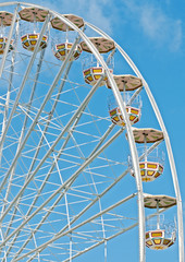 Detail of a Ferris Wheel against the blue sky