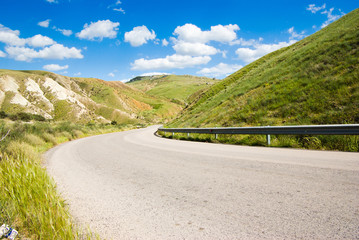 hill road with white cloud
