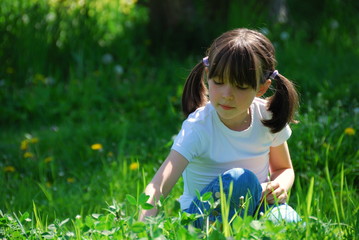 Girl sitting in the meadow
