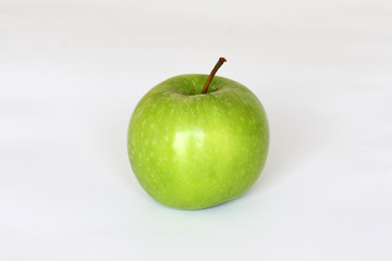 A green apple on a white background
