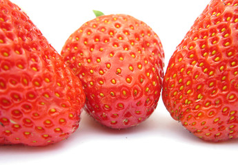 Three strawberries isolated on white background