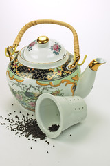 teapot and tea on white close-up