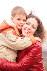 mother and son embrace each other close-up