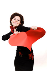 Woman tearing big red peper heart