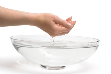 Woman's hands scooping fresh water