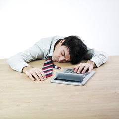 Obraz premium Businessman sleeping on a table