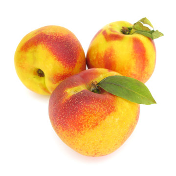 Nectarines peaches isolated on white background
