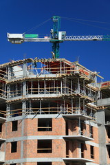 Construction crane against blue sky