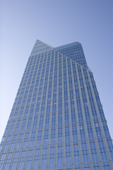 Blue Glass Tower Against Blue Sky