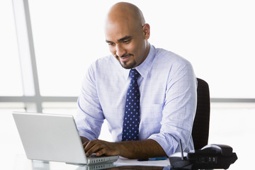 Businessman working at laptop