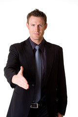 caucasian man in business suit making a hand shake