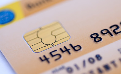 Close up details of Credit card with microchip and numbers. Visa payments plastic money