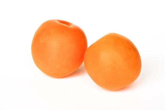 Apricots on white background