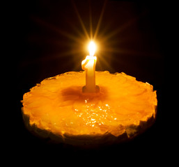 Birthday cake with burning candle