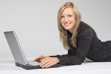 Naklejka premium Businesswoman with laptop - smiling
