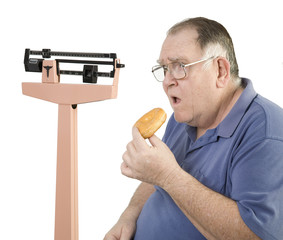 big guy and donut looking at scale
