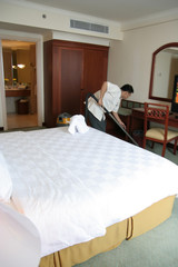 housekeeping or room boy in action