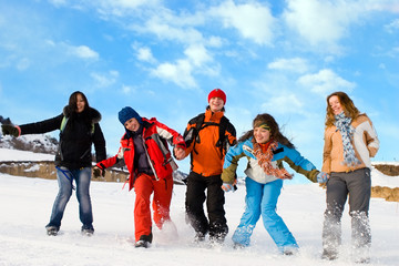 Group of sport teens different ethnicity jumping winter outdors