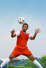 Soccer player heading ball