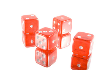 four red glass dices on white background