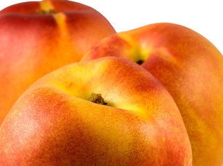 3 fresh ripe Nectarines on a white background