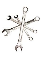 Assorted spanners over white background