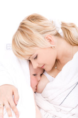 Obraz na płótnie Canvas Mother breast feeding her baby girl