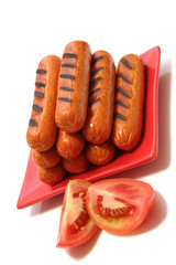 grilled sausages with two tomatoes quarter