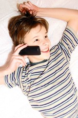 Teen boy talking on cell phone