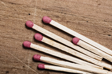 Matches on wooden surface.