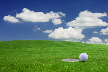 Golf - detail ball with hole on green