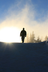 Man walking down a mountain