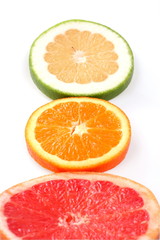 Three slice fresh citrus isolated on white