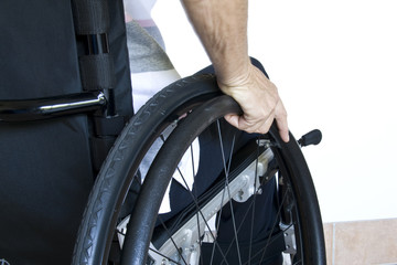 Woman propelling wheelchair