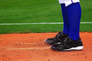 Baseball pitcher, standing on the mound