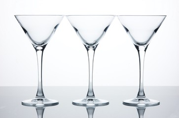 Three empty martini glasses