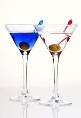 Two martinis with olives