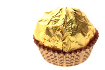 chocolate sweet on golden foil wrapping