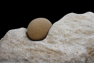 Smooth stone and rock, isolated on black background