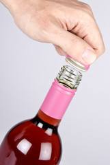 Opening Bottle of Rosé Wine with a Screwcap