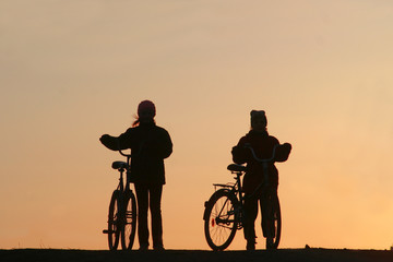 Fototapeta na wymiar Two girls on bicycles