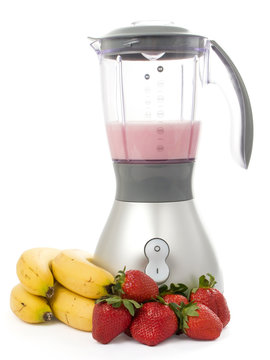 Blender with strawberries and bananas
