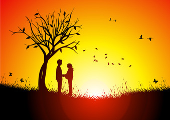 Couple at sunset under a tree