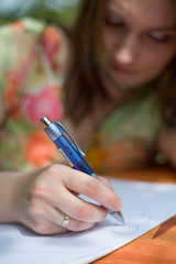 Girl writing in exercise book